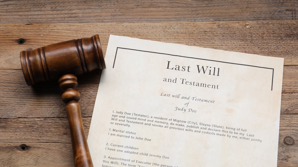 Last Will and Testament with gavel on wooden table