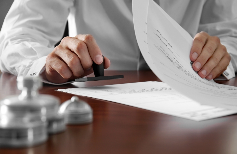 lawyer puts a stamp on the documents