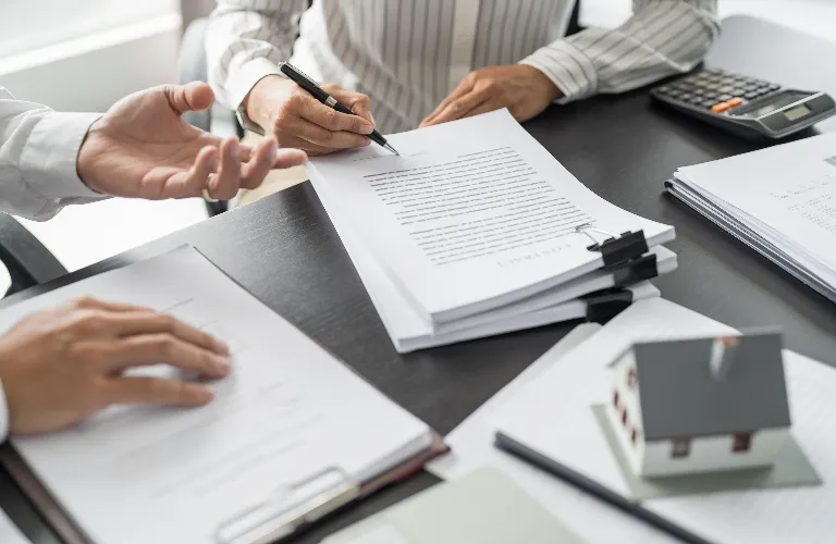 two men reviewing legal paperwork